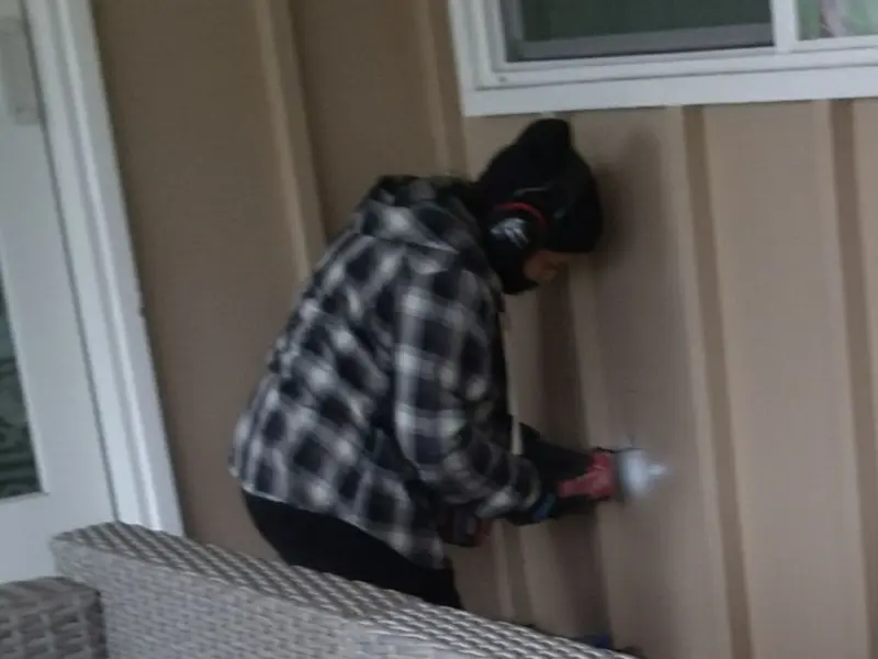 Professional electrician installing an exterior outlet in Verona